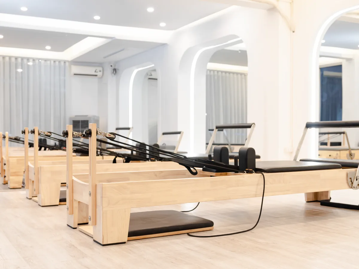 The studio floor, wooden reformers in a row